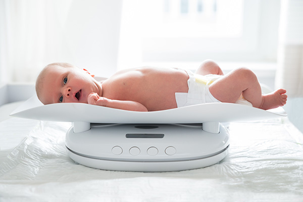 picture of baby being weighed